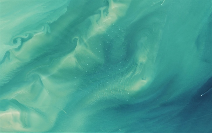 Post-processed satellite images of turbulent sediment plumes downstream of offshore wind turbines near the UK coast. Photo: NASA Earth Observatory / Jesse Allen  Thames Oli 2015181 Lrg Zoom6